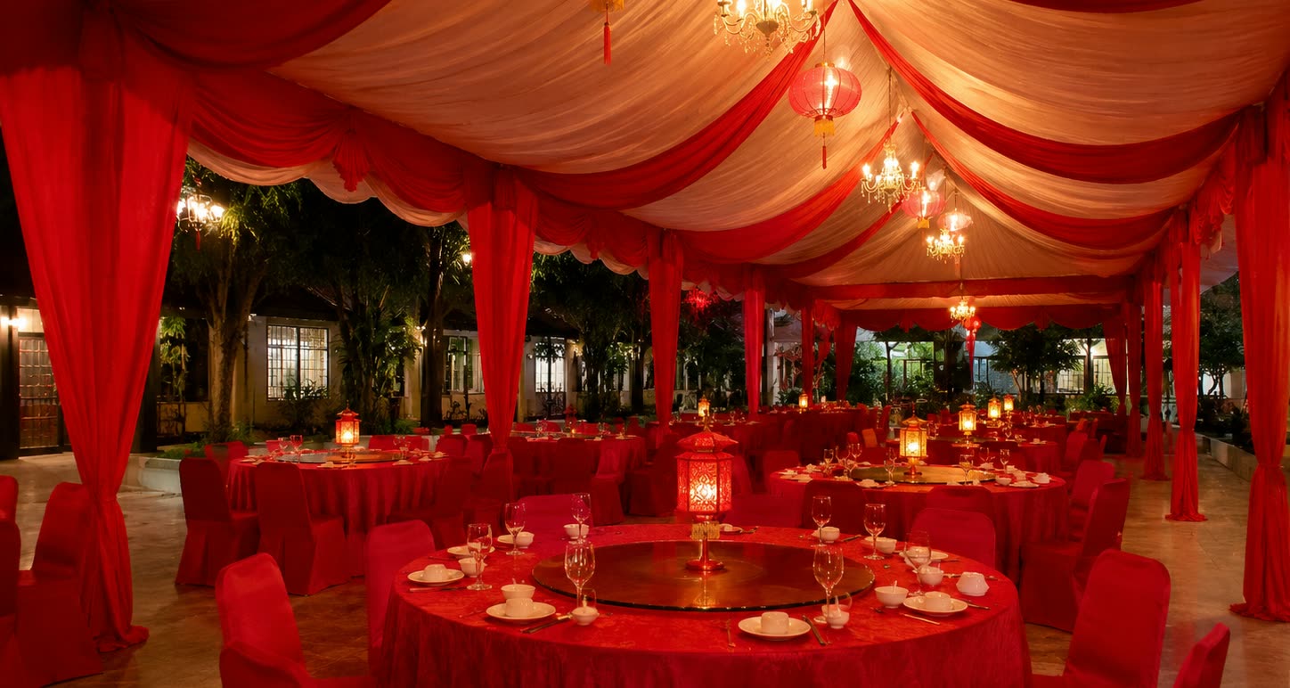Night Chinese banquet marquee with red tablecloths, lantern centrepieces and chandeliers