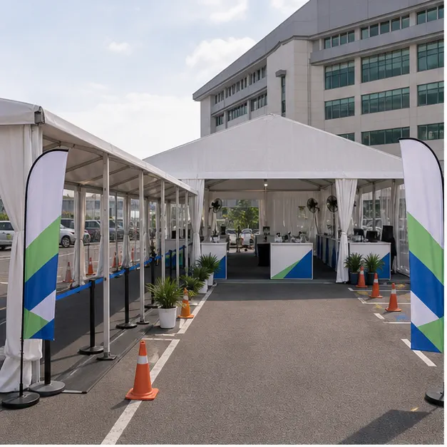 Columbia Asia Shah Alam outdoor support setup with waiting marquee, side wall option, queue lanes, support counters, chairs and fans