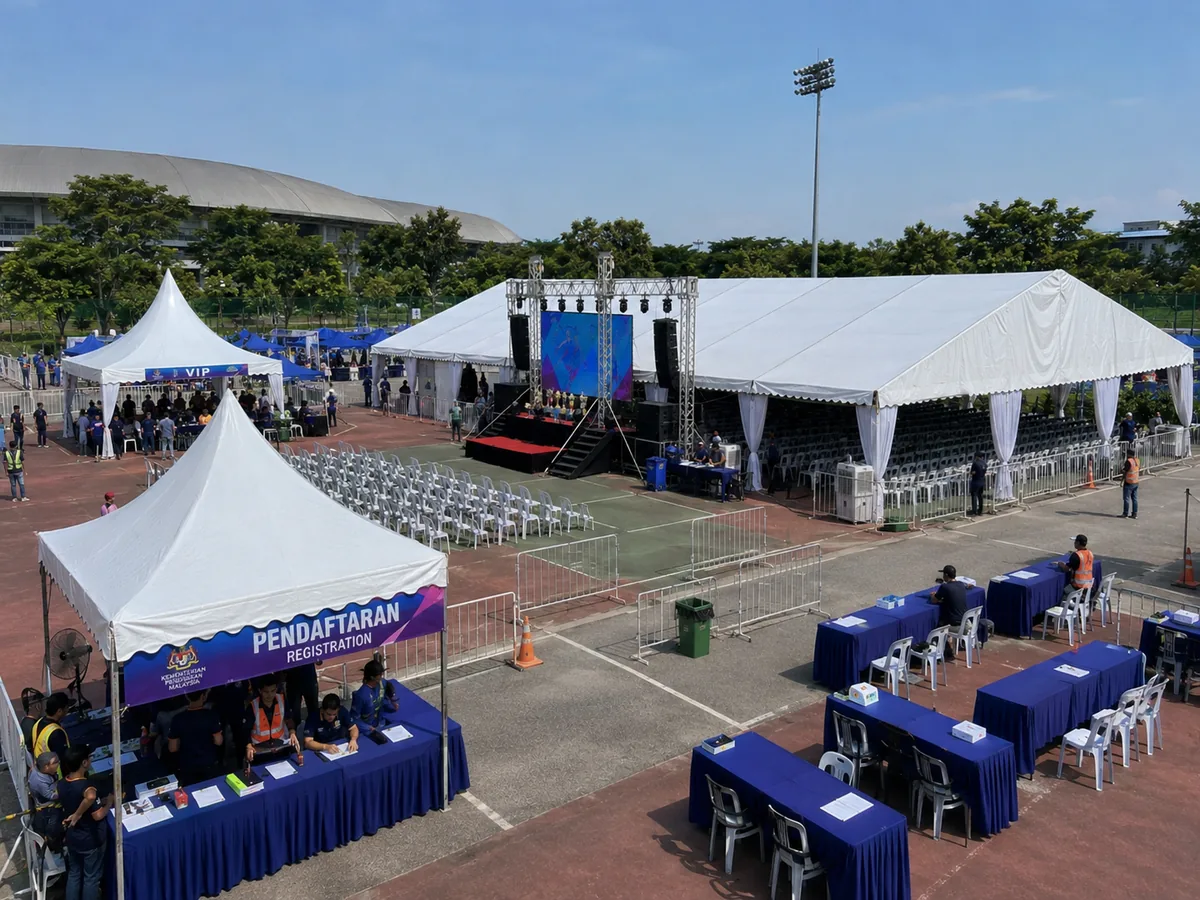 Kompleks Sukan Pandamaran registration canopy and VIP tent setup with covered marquee, LED stage, queue barriers and sports day seating