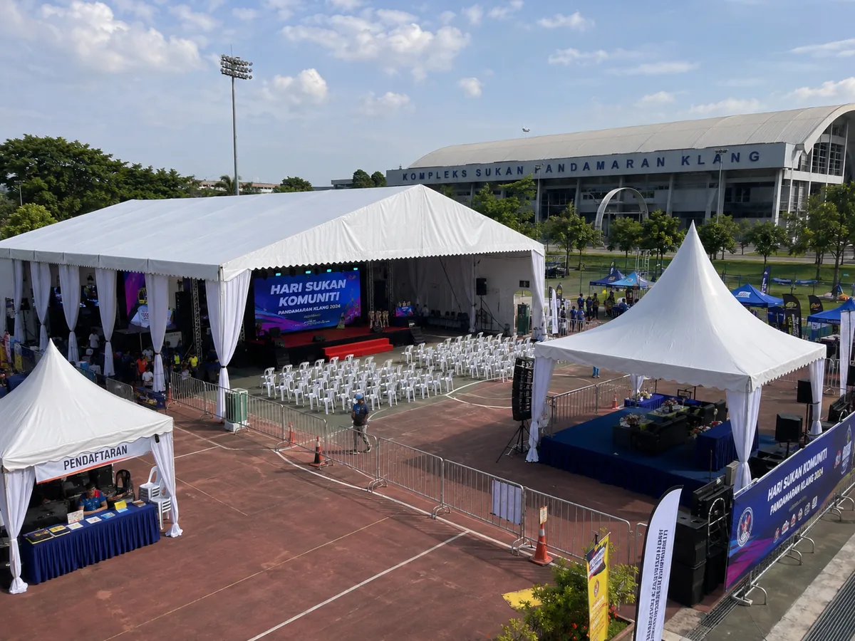 Kompleks Sukan Pandamaran Klang sports day setup with wide covered marquee, LED stage, registration canopy, VIP tent and spectator seating