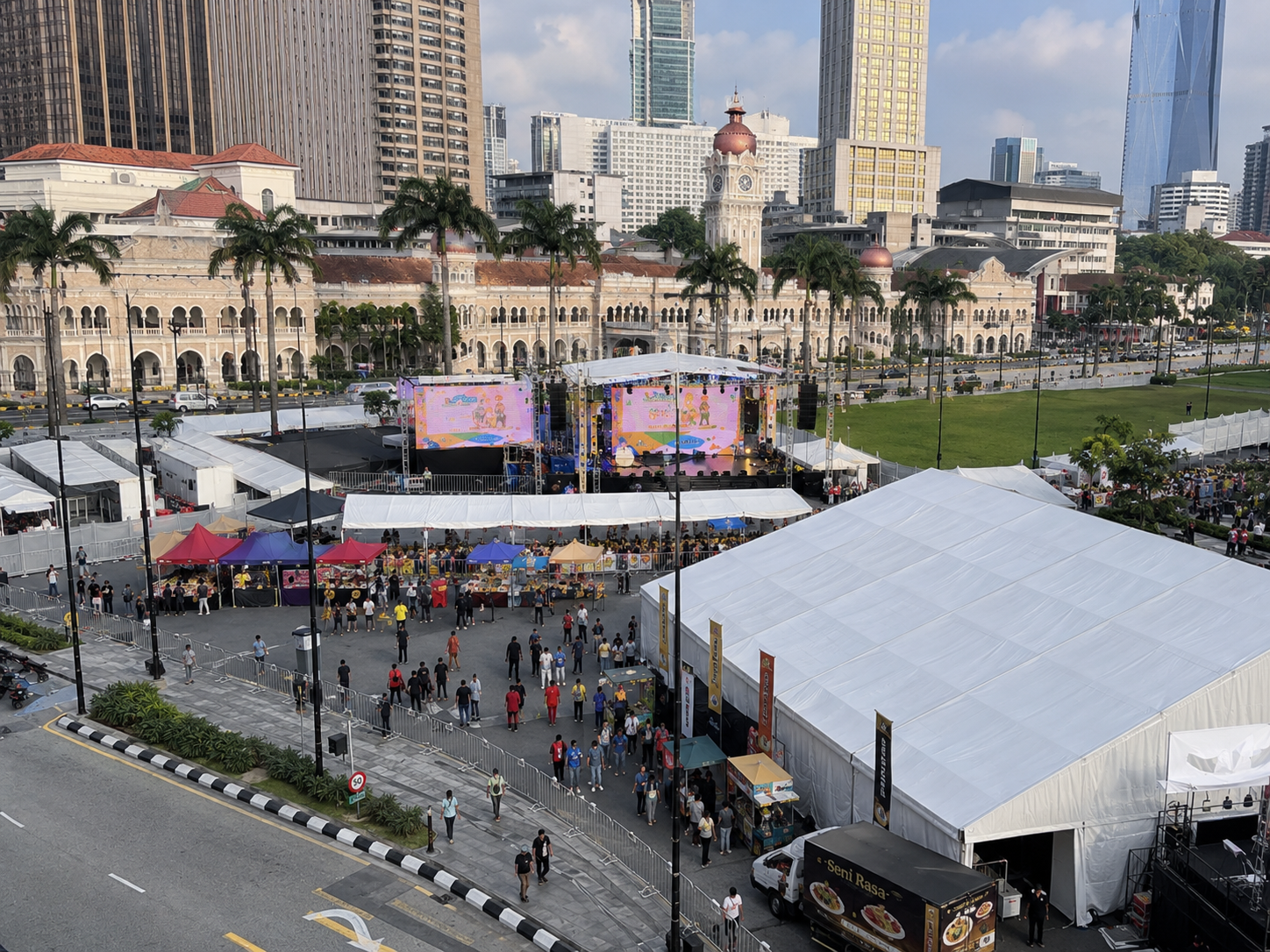 Portfolio concept side angle of a Kuala Lumpur city square bazaar event with marquee tent, public celebration stage, booth canopies and heritage-style urban backdrop