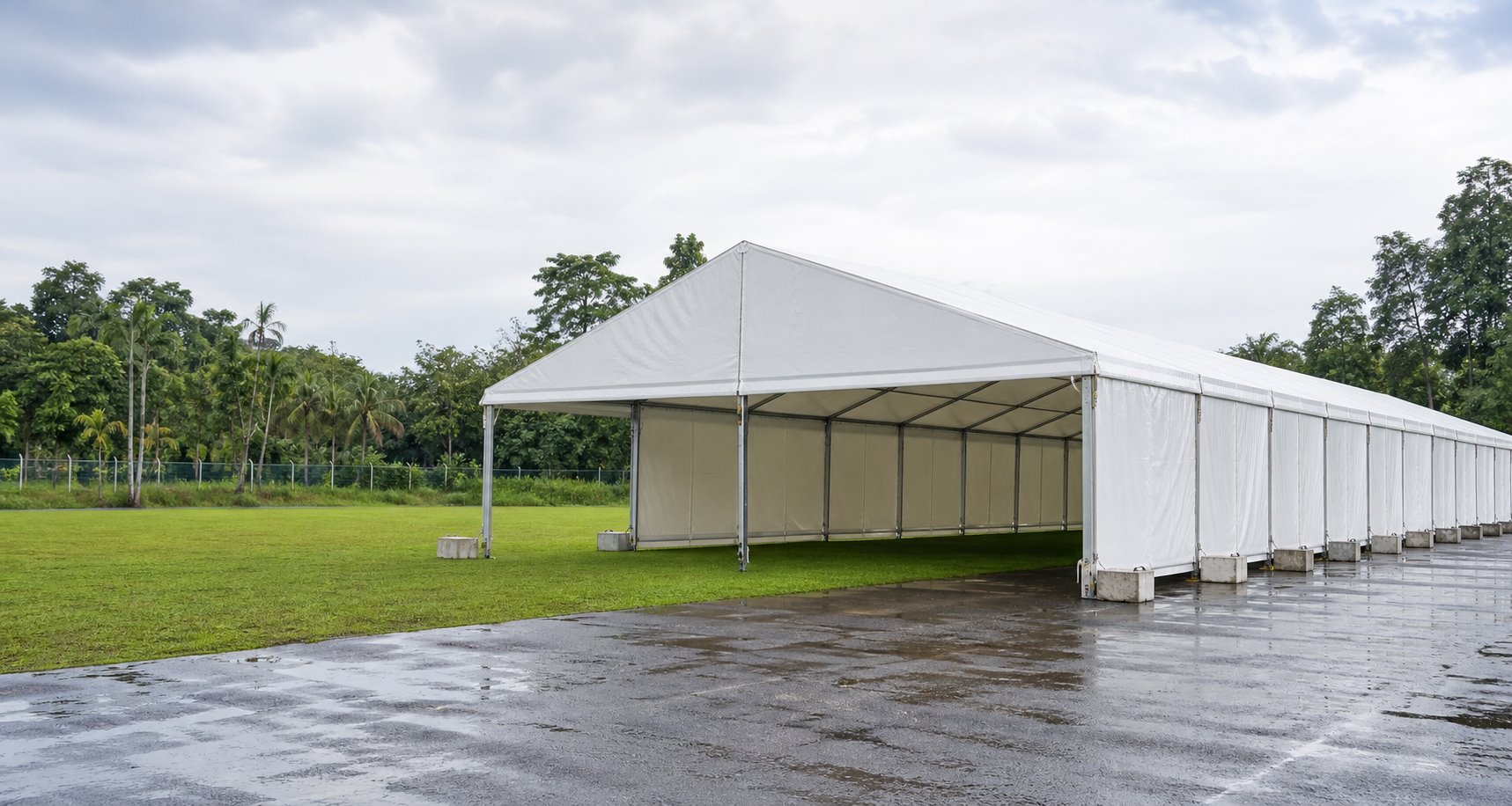 Outdoor marquee rental hero view with covered event setup, clear guest area and marquee structure reference