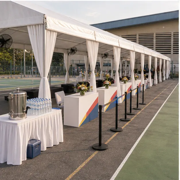 Side angle of Pandamaran Klang sports day marquee setup with covered seating, registration support, stage area and public event flow
