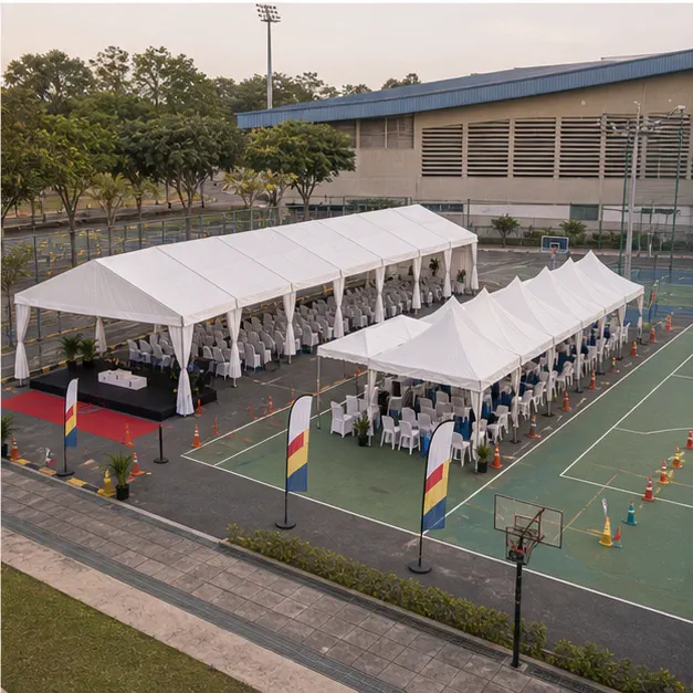 Wide layout angle of Pandamaran Klang sports day marquee with guest seating, stage support, registration area and open court access
