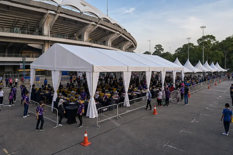 Stadium Malawati sports day setup with classic white marquee, booth canopies, registration counters, seating and queue lanes