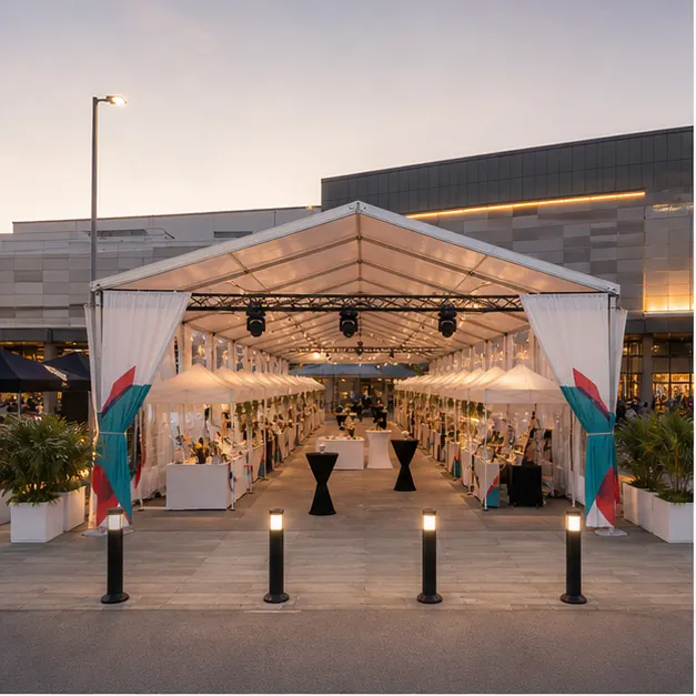The Curve Mutiara Damansara weekend bazaar setup with modular marquee, vendor canopy rows, lifestyle booths and clean guest aisle