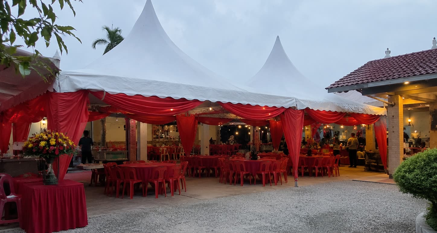 Twin peak red canopy open house setup with red tables and red chairs