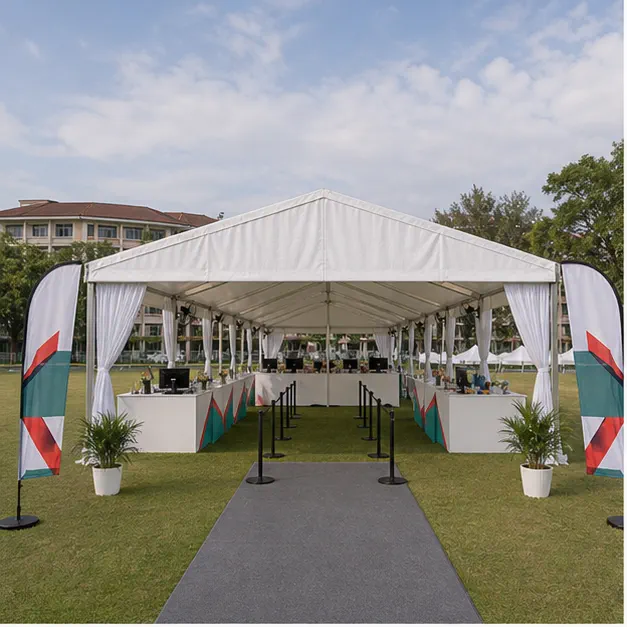 UPM Serdang open field sports village setup with marquee, covered walkway, registration counters, support booths and shaded seating