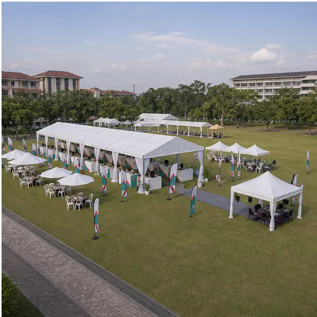 High angle view of a university open field event layout with marquee, covered walkway, support booths, seating and pedestrian routes